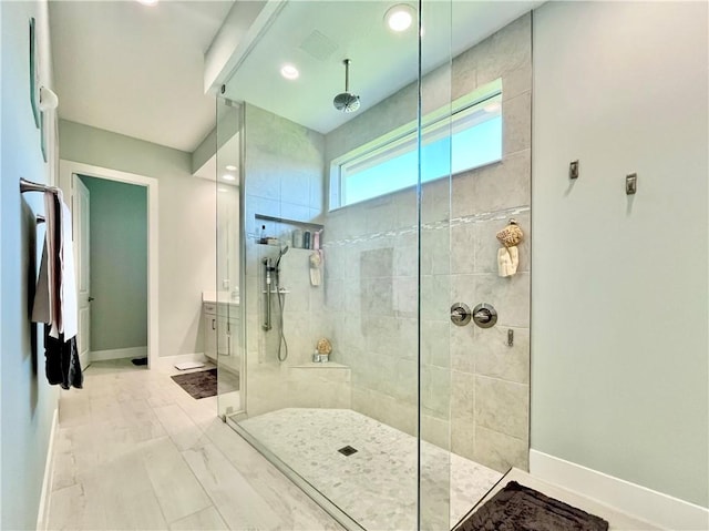 bathroom with tiled shower