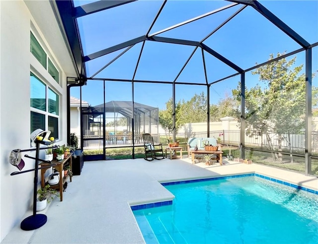 view of pool with a lanai and a patio area