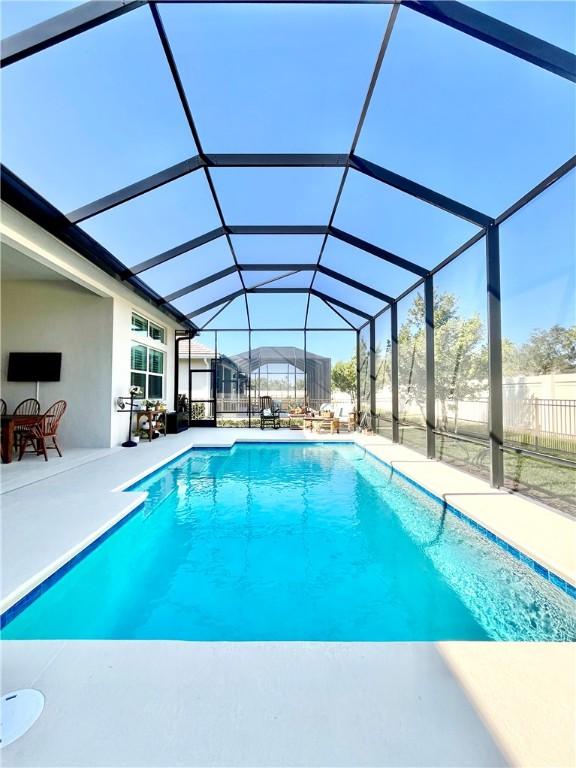 view of pool featuring a lanai and a patio area