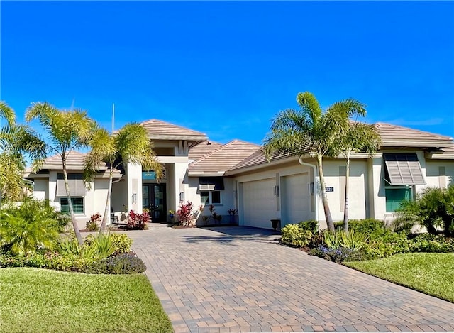 view of front facade with a garage and a front yard