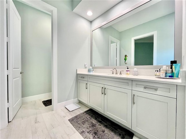 bathroom featuring vanity and wood-type flooring