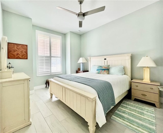 bedroom featuring light wood-type flooring and ceiling fan