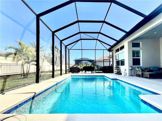 view of pool with a lanai and a patio area