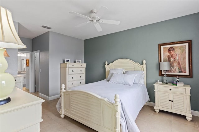 bedroom featuring light tile patterned floors, baseboards, visible vents, and a ceiling fan