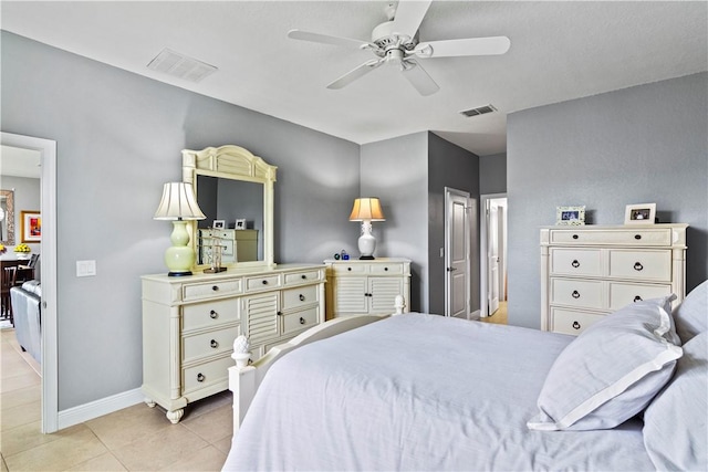 bedroom featuring light tile patterned floors, baseboards, visible vents, and a ceiling fan