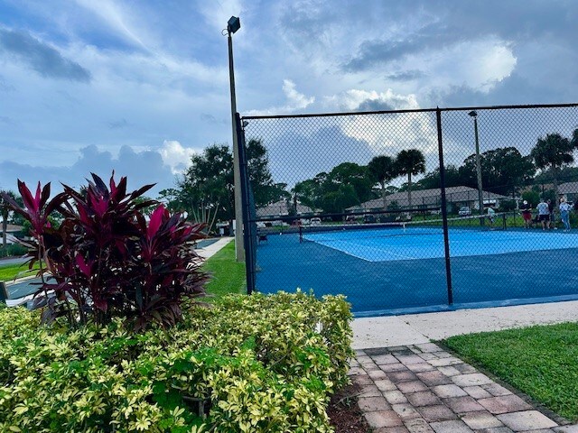 exterior space with tennis court