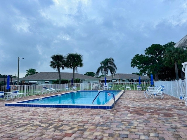 view of swimming pool featuring a patio area