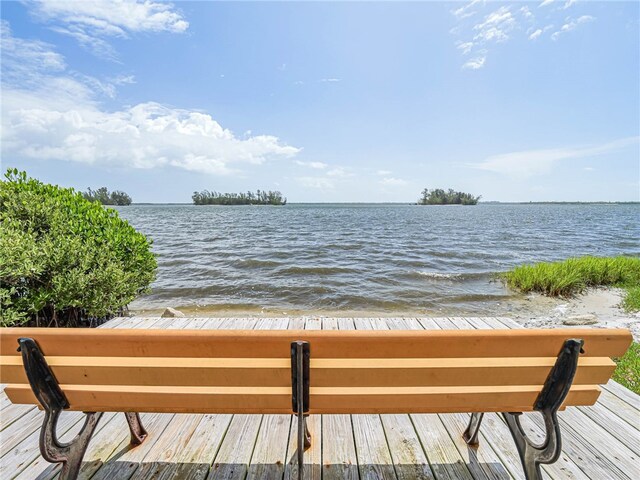 wooden terrace with a water view