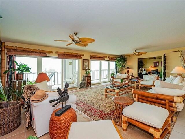 tiled living room with ceiling fan