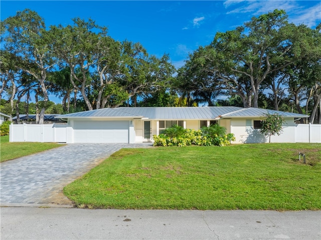 ranch-style house with a front lawn and a garage