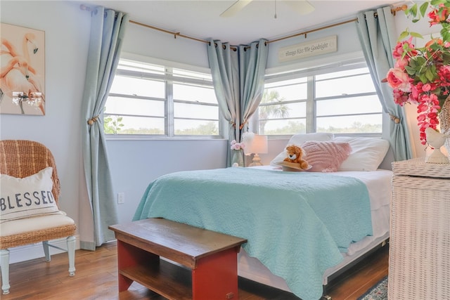 bedroom with hardwood / wood-style flooring and ceiling fan