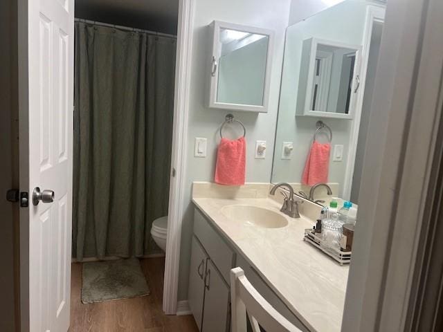 1801 Indian River Blvd Unit C1, Vero Beach, FL 32960 - bathroom with vanity, wood finished floors, and a shower with curtain