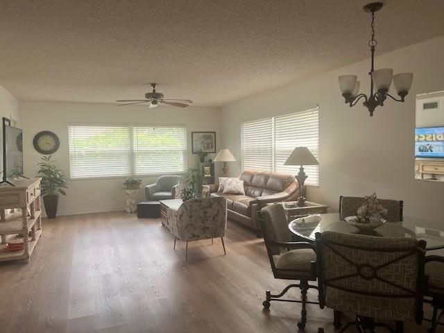 1801 Indian River Blvd Unit C1, Vero Beach, FL 32960 - living room featuring a chandelier, wood finished floors, a textured ceiling, and ceiling fan