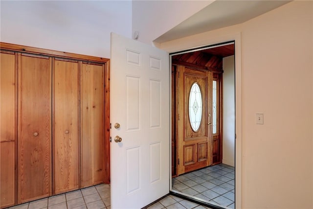 entrance foyer featuring light tile patterned floors