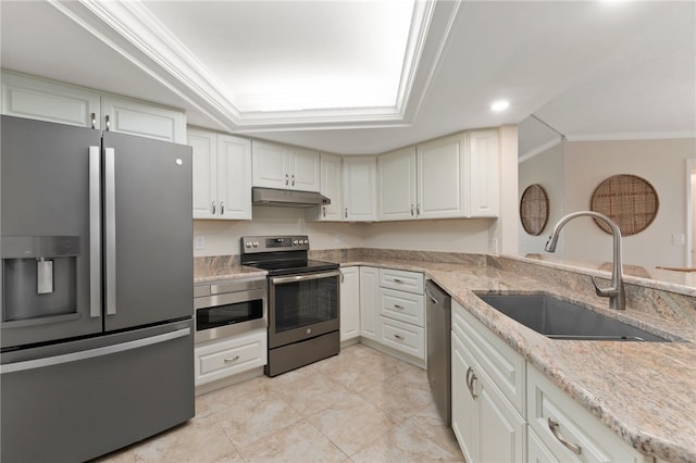 kitchen with white cabinets, sink, appliances with stainless steel finishes, and ornamental molding