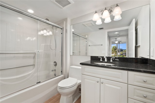 full bathroom with shower / bath combination with glass door, vanity, and toilet