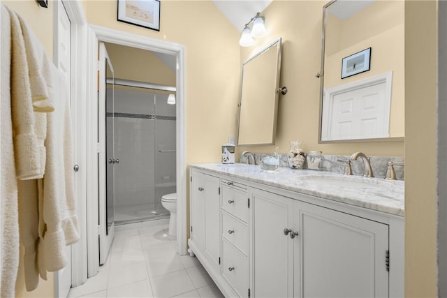 1541 Sabal Ct, Vero Beach, FL 32963 - bathroom featuring toilet, double vanity, a stall shower, and tile patterned flooring