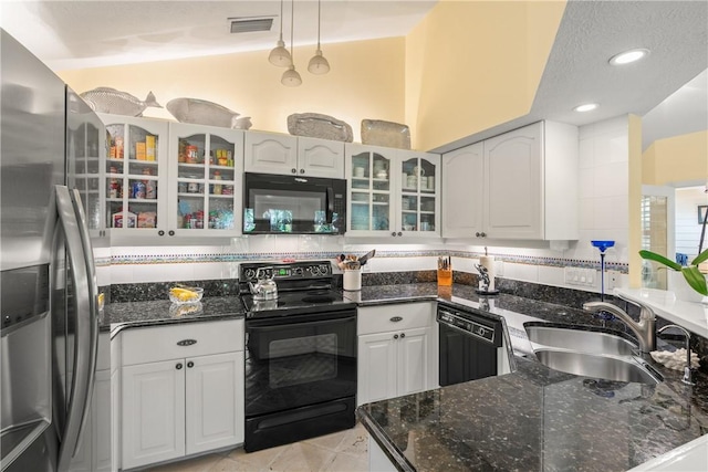 1541 Sabal Ct, Vero Beach, FL 32963 - kitchen with black appliances, a sink, white cabinetry, glass insert cabinets, and recessed lighting