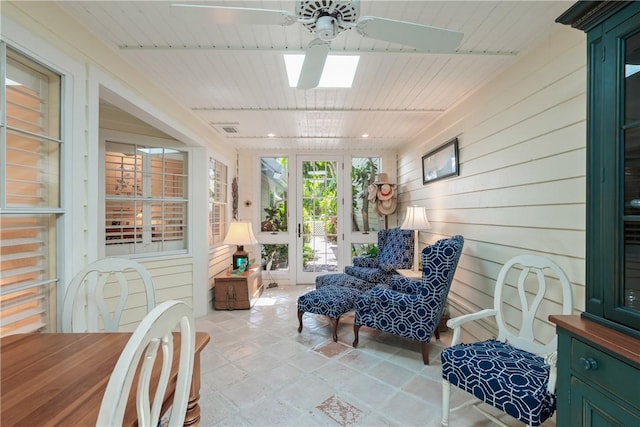 1541 Sabal Ct, Vero Beach, FL 32963 - sunroom / solarium with a ceiling fan, a skylight, and wood walls