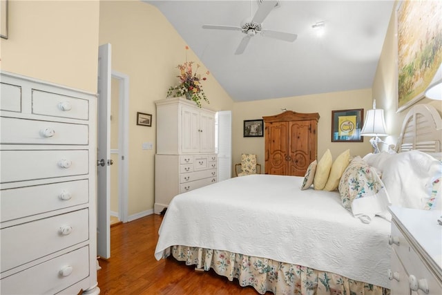 1541 Sabal Ct, Vero Beach, FL 32963 - bedroom featuring wood finished floors, lofted ceiling, baseboards, and ceiling fan