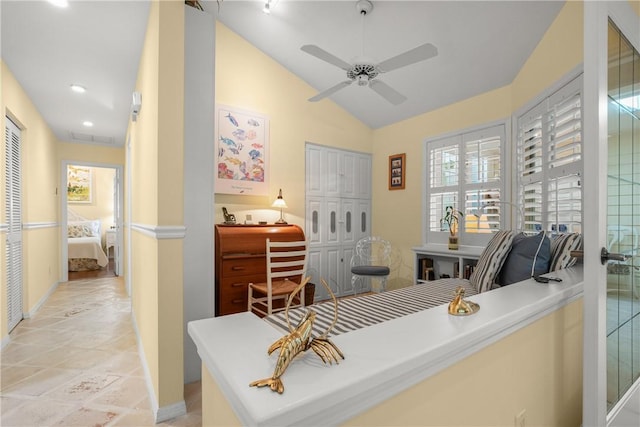1541 Sabal Ct, Vero Beach, FL 32963 - office area featuring ceiling fan, vaulted ceiling, baseboards, and light stone finish flooring