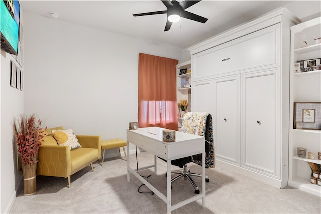 office space featuring ceiling fan and light colored carpet