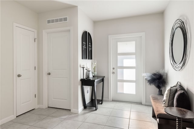 entryway featuring light tile patterned floors