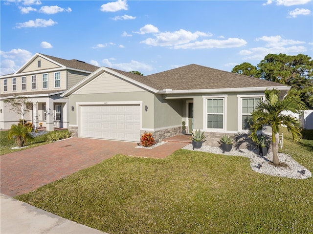 view of front facade with a garage and a front yard