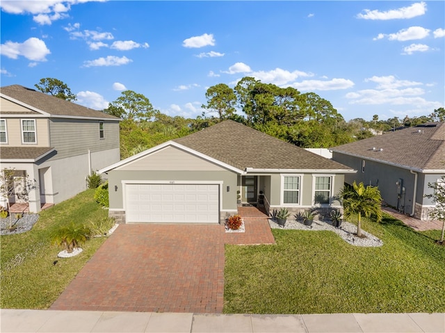 ranch-style home with a front yard and a garage