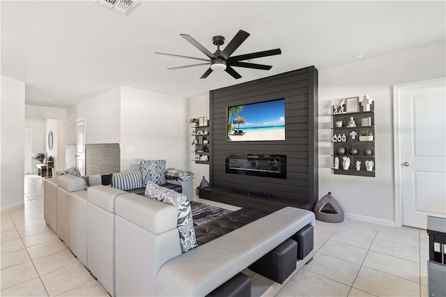 tiled living room featuring ceiling fan