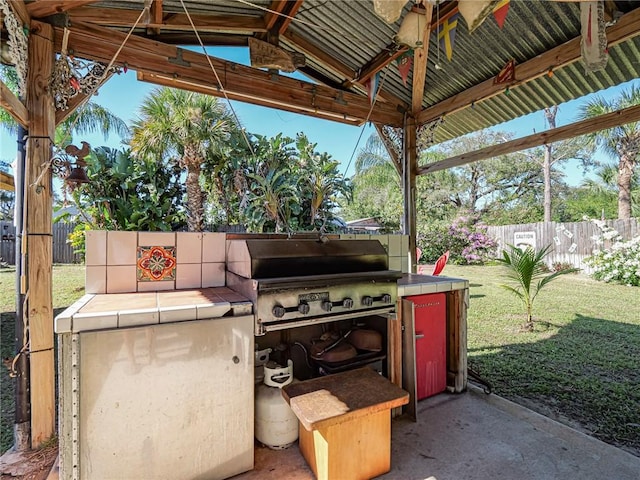 view of patio featuring fence