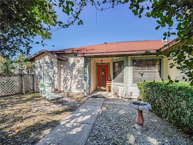 view of front of house with fence