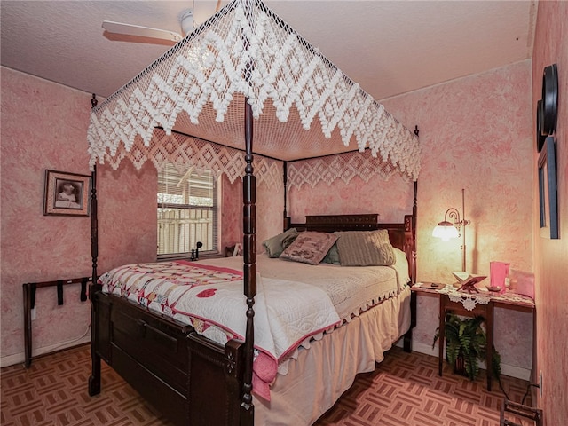 bedroom featuring parquet floors and ceiling fan