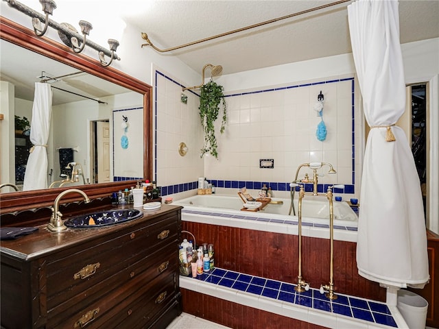 bathroom featuring vanity, shower / bathtub combination with curtain, and a textured ceiling