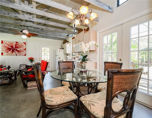 dining room with beamed ceiling and ceiling fan with notable chandelier