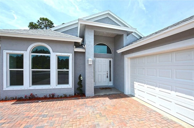 property entrance featuring a garage