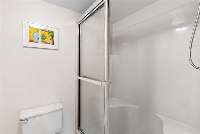 25 Plantation Dr Unit 201, Vero Beach, FL 32966 - full bathroom featuring a shower with door and toilet