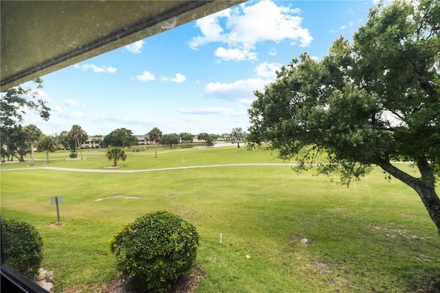 25 Plantation Dr Unit 201, Vero Beach, FL 32966 - view of property's community with view of golf course and a yard