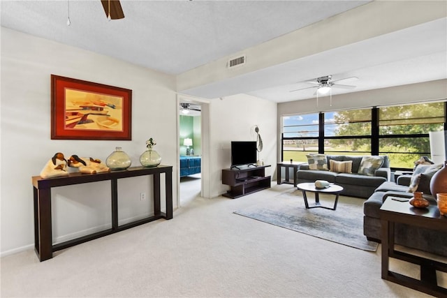 25 Plantation Dr Unit 201, Vero Beach, FL 32966 - living room featuring a ceiling fan and carpet flooring