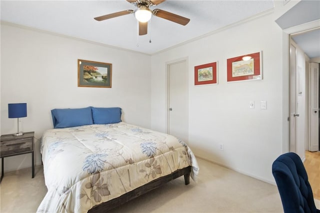 25 Plantation Dr Unit 201, Vero Beach, FL 32966 - bedroom with light carpet, a ceiling fan, baseboards, and ornamental molding