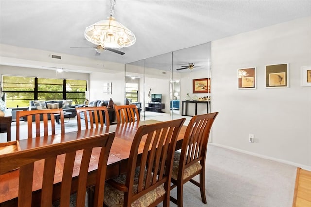 25 Plantation Dr Unit 201, Vero Beach, FL 32966 - dining space featuring a ceiling fan, baseboards, and carpet flooring