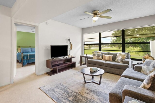 25 Plantation Dr Unit 201, Vero Beach, FL 32966 - living area with a ceiling fan and carpet floors