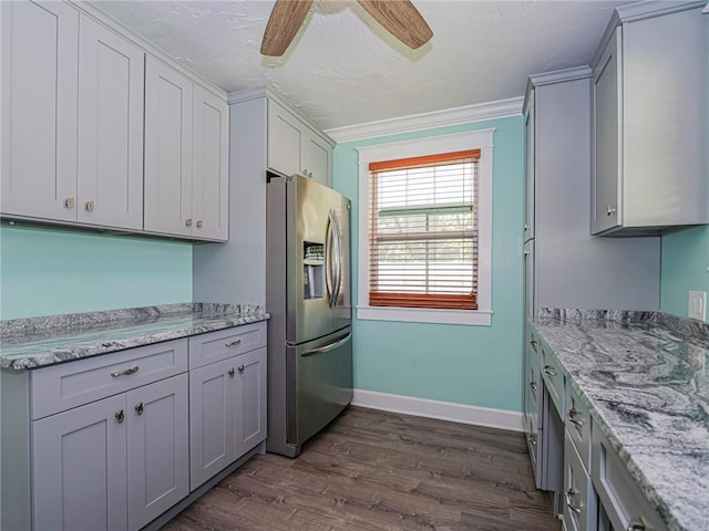 kitchen featuring stainless steel fridge with ice dispenser, gray cabinetry, dark wood-style flooring, and ornamental molding