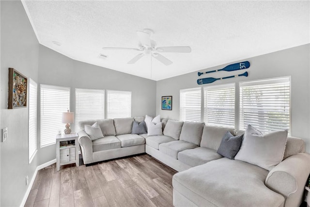 860 Pirates Cove Ln, Fort Pierce, FL 34949 - living room with a ceiling fan, plenty of natural light, wood finished floors, and lofted ceiling