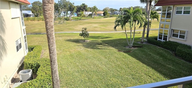 view of yard featuring central air condition unit