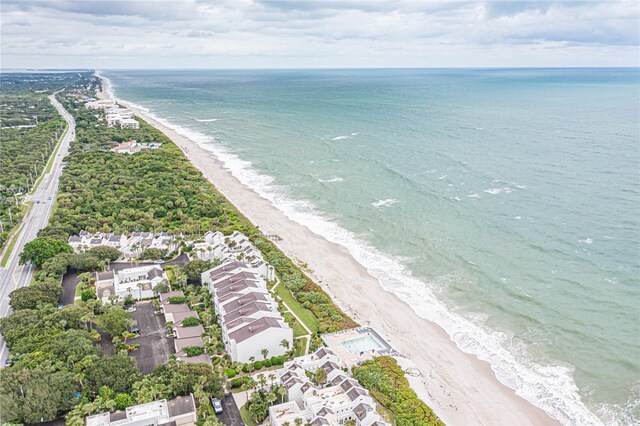 aerial view with a view of the beach and a water view