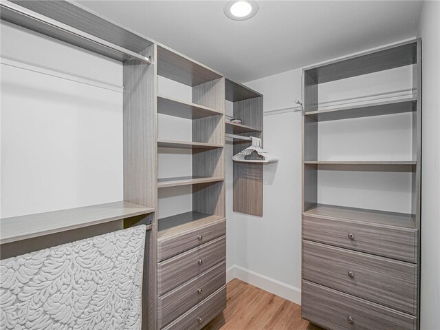 walk in closet featuring light wood-type flooring