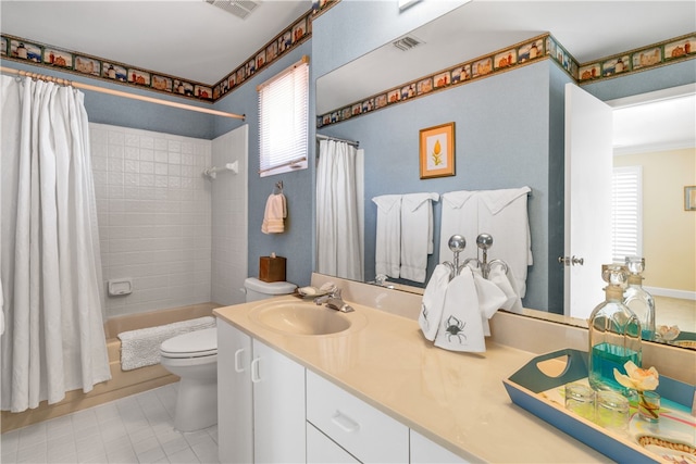 full bathroom featuring shower / tub combo with curtain, vanity, toilet, and tile patterned flooring