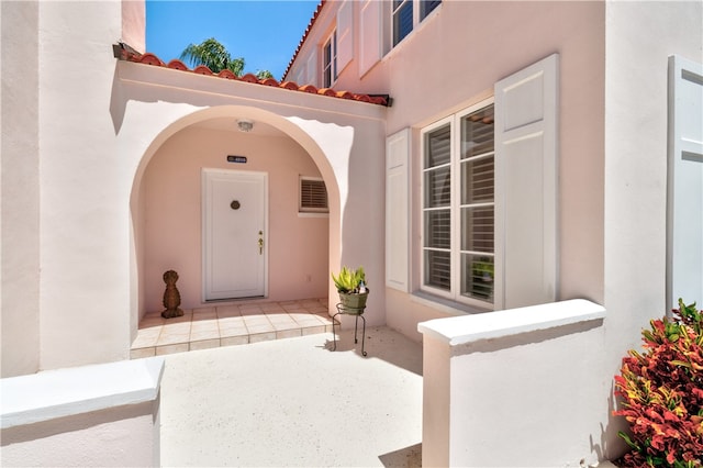 doorway to property with a patio area