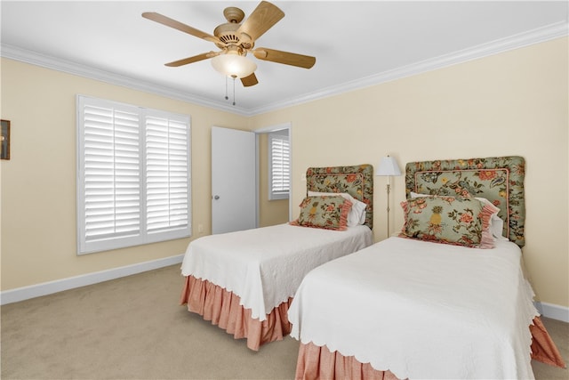 bedroom featuring ceiling fan, crown molding, and carpet floors